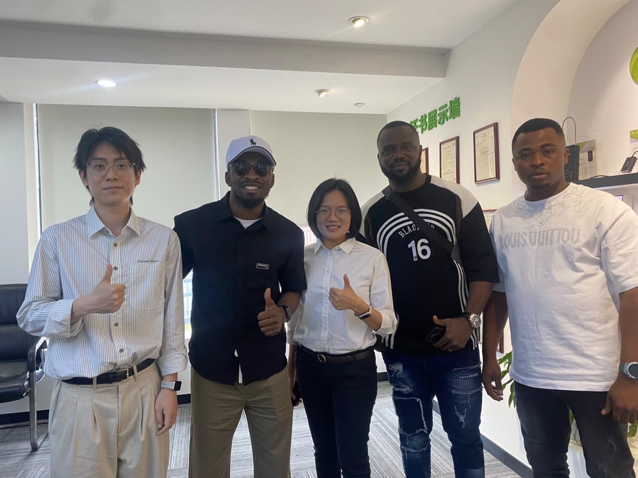 Fourfour Technology team members with international partners
