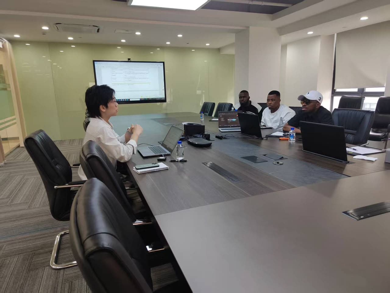 Technology teams collaborating around a conference table
